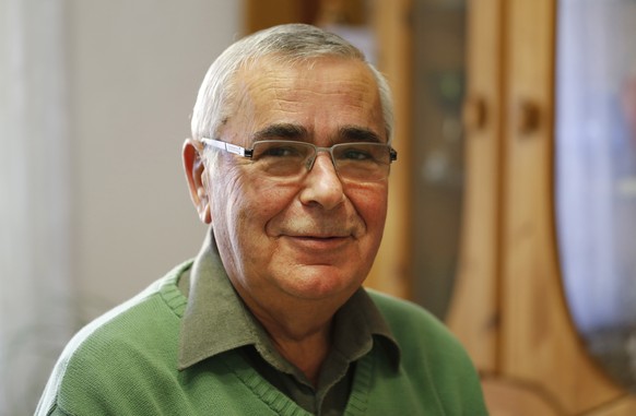 Former border guard Harald Jaeger poses for a photograph in his flat in Werneuchen, east of Berlin, Germany, Friday, Nov. 7, 2014. Nearly 25 years since the fall of the Berlin Wall Jaeger has no troub ...