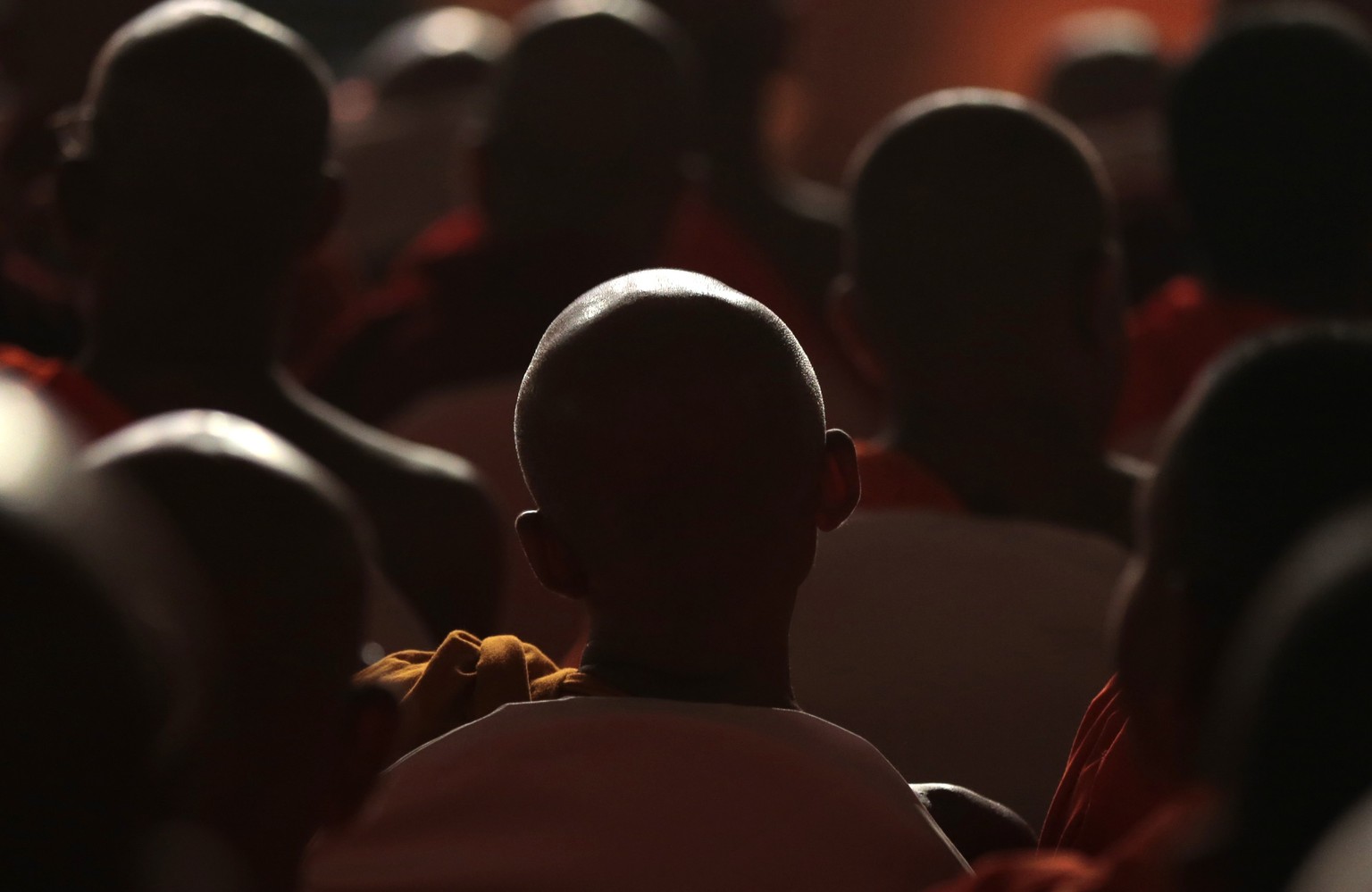 Sri Lankan Buddhist monks listen to Myanmar&#039;s hard-line Buddhist monk Ashin Wirathu speak at a convention organized by Sri Lanka&#039;s Bodu Bala Sena or Forces of Buddhist Power in Colombo, Sri  ...