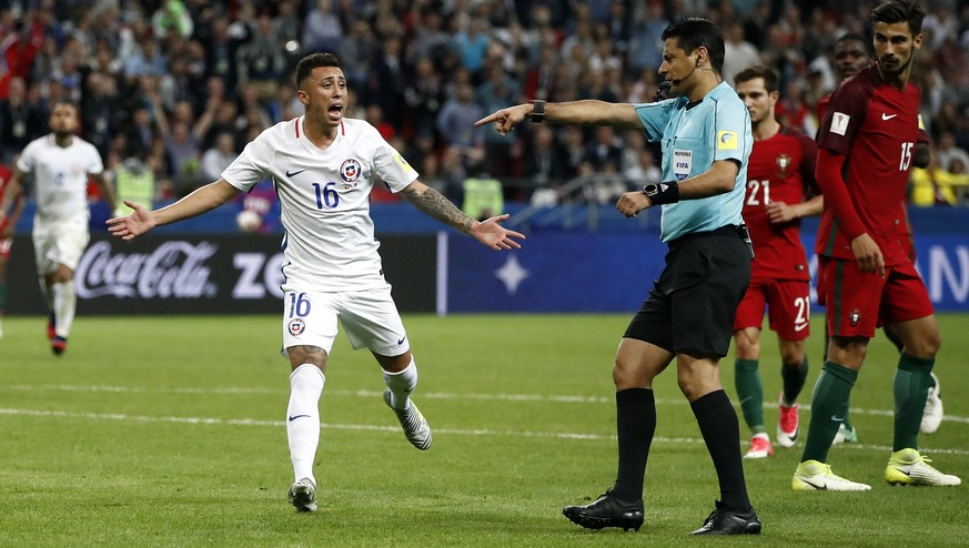 Chile&#039;s Martin Rodriguez gestures to referee Alireza Faghani during the Confederations Cup, semifinal soccer match between Portugal and Chile, at the Kazan Arena, Russia, Wednesday, June 28, 2017 ...