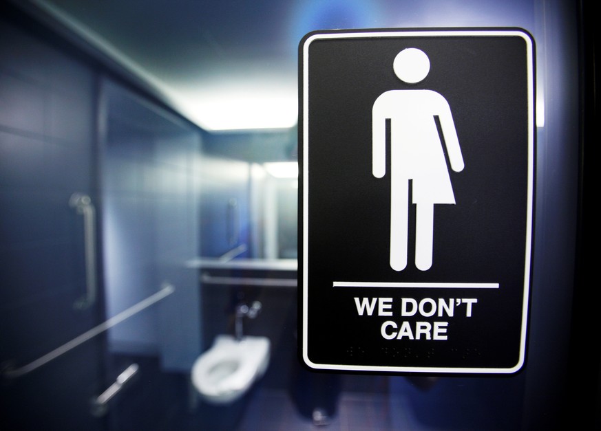 FILE PHOTO -- A sign protesting a recent North Carolina law restricting transgender bathroom access adorns the bathroom stalls at the 21C Museum Hotel in Durham, North Carolina May 3, 2016. REUTERS/Jo ...