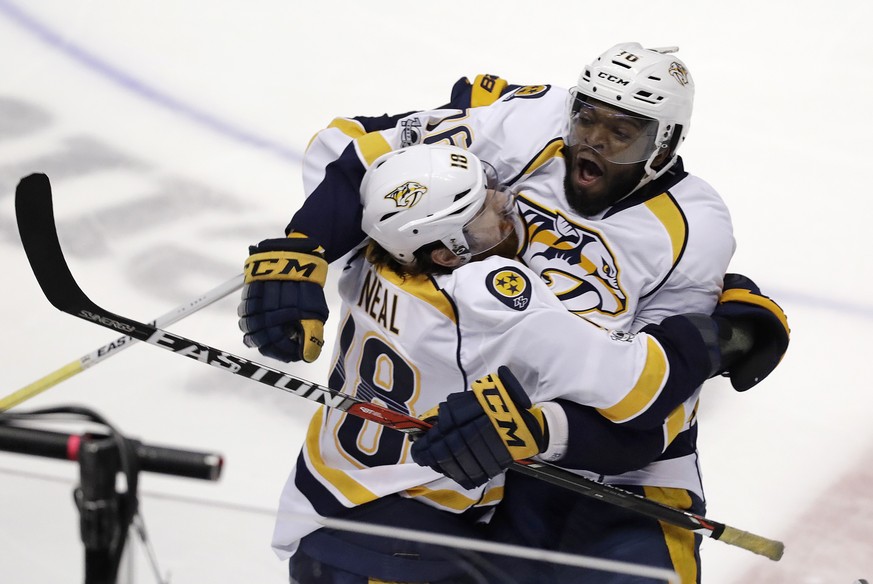 Nashville Predators James Neal, left, celebrates after scoring against the Anaheim Ducks off an assist by defenseman P.K. Subban, right, in overtime of Game 1 in the NHL hockey Stanley Cup Western Con ...