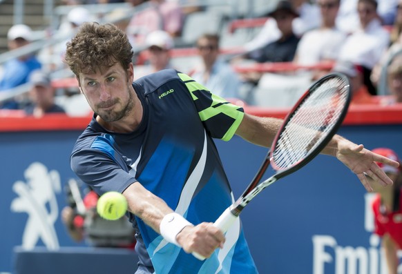 Robin Haase, of the Netherlands, returns to Diego Schwartzman, of Argentina, during quarterfinal match at the Rogers Cup tennis tournament in Montreal, Friday, Aug. 11, 2017. (Paul Chiasson/The Canadi ...