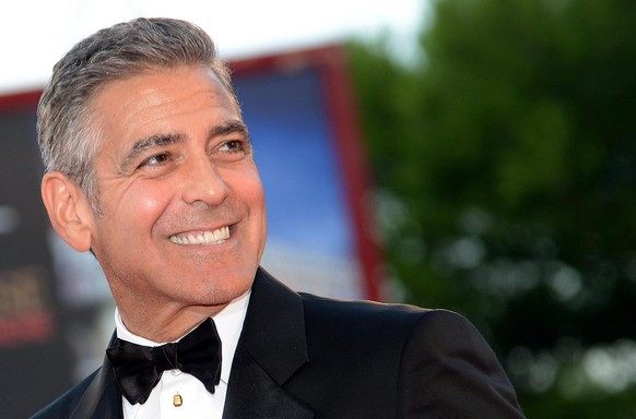 epa04182115 (FILE) The file picture dated 28 August 2013 shows US actor/cast member George Clooney arriving for the premiere of &#039;Gravity&#039; at the 70th annual Venice International Film Festiva ...