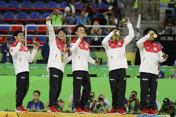 2016 Rio Olympics - Artistic Gymnastics - Final - Men&#039;s Team Final - Rio Olympic Arena - Rio de Janeiro, Brazil - 08/08/2016. Japan gymnasts on the podium with their gold medals after winning the ...