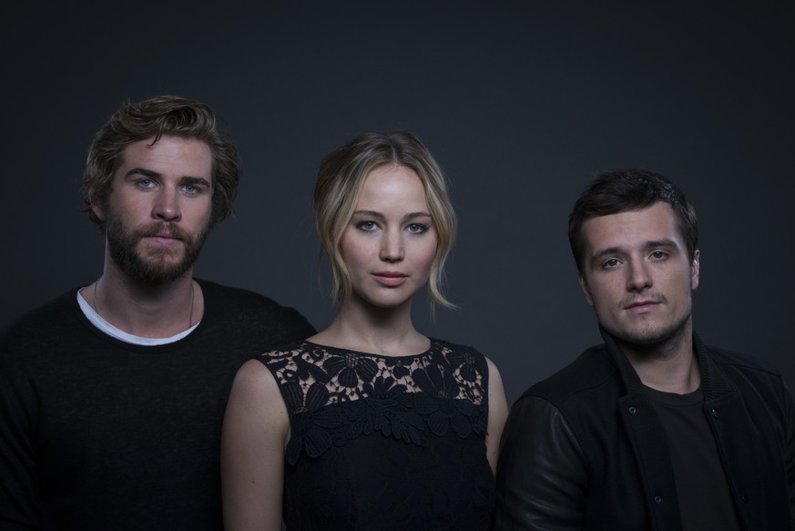 Jennifer Lawrence mit ihren Filmpartnern&nbsp;Liam Hemsworth (links) und Josh Hutcherson (rechts).