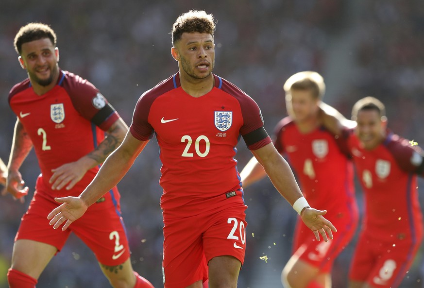 England&#039;s Alex Oxlade-Chamberlain, center, celebrates his goal during the World Cup Group F qualifying soccer match between Scotland and England at Hampden Park, Glasgow, Scotland, Saturday, June ...
