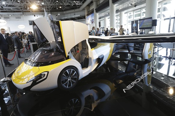 AeroMobil display their latest prototype of a flying car, in Monaco, Thursday, April 20, 2017. The light frame plane whose wings can fold back, like an insect is boosted by a rear propeller. The compa ...