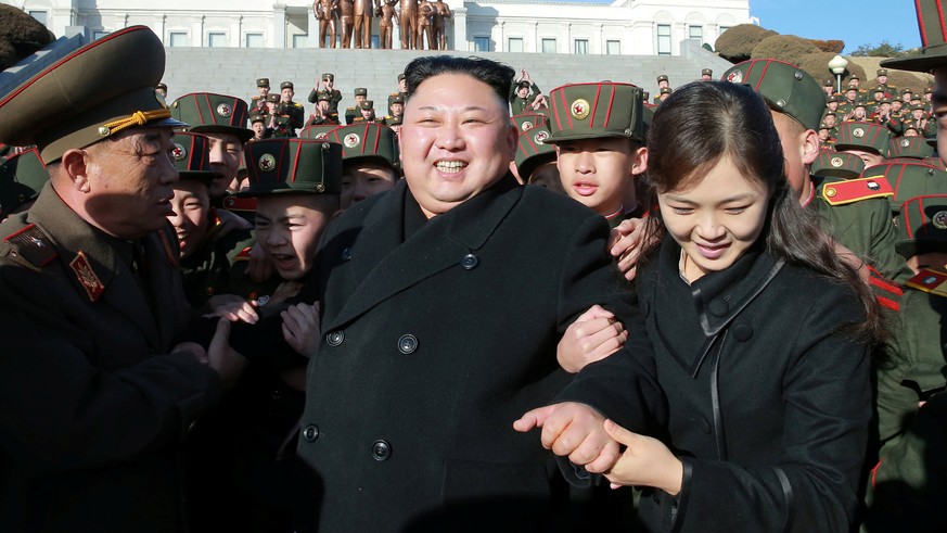 North Korean leader Kim Jong Un visited Mangyongdae Revolutionary School and planted trees with its students on Thursday, the Tree-planting Day, in this undated photo released by North Korea&#039;s Ko ...