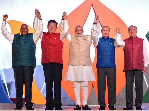 epa05586786 (L-R) South African President Jacob Zuma, Chinese President Xi Jinping, Indian Prime Minister Narendra Modi, Russian President Vladimir Putin and Brazilian President Michel Temer pose for  ...