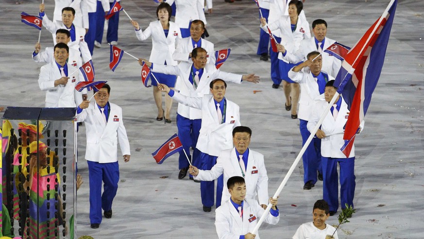 2016 Rio Olympics - Opening ceremony - Maracana - Rio de Janeiro, Brazil - 05/08/2016. Flagbearer Choe Jon Wi (PRK) of North Korea leads his contingent during the opening ceremony. REUTERS/Stoyan Neno ...