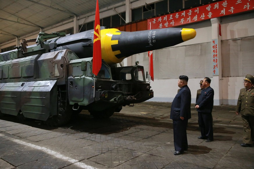 epa05965791 An undated photo released 15 May 2017 by North Korean Central News Agency (KCNA) showing North Korean leader Kim Jong Un (C) viewing a missile after North Korea on 15 May reported they had ...