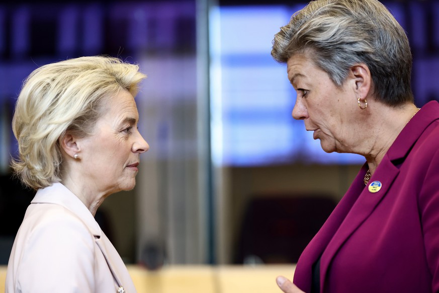 European Commission President Ursula von der Leyen, left, speaks with European Commissioner for Home Affairs Ylva Johansson during the weekly College of Commissioners meeting at EU headquarters in Bru ...