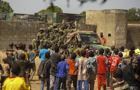 epa05734610 Senegalese children watch Senegalese military troops waiting at the border of Senegal and Gambia near the border town of Karang, Senegal, 20 January 2017. West African military forces are  ...