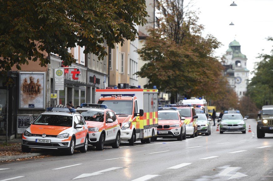 Ambulances stand at Rosenheimer Platz square in Munich, Germany, Saturday, Oct. 21, 2017. Police say a man with a knife has lightly wounded several people in Munich. Officers are looking for the assai ...