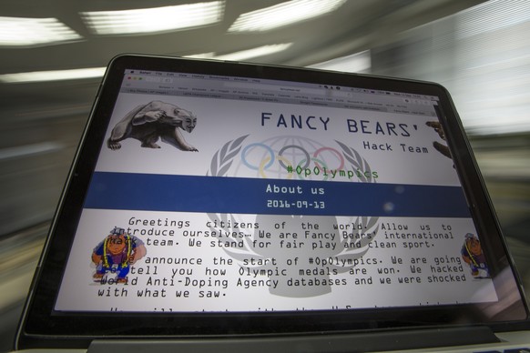 FILE - This Wednesday, Sept. 14, 2016, file screenshot shows the Fancy Bears website fancybear.net on a computer screen in Moscow, Russia. Having made their name by breaching a World Anti-Doping Agenc ...