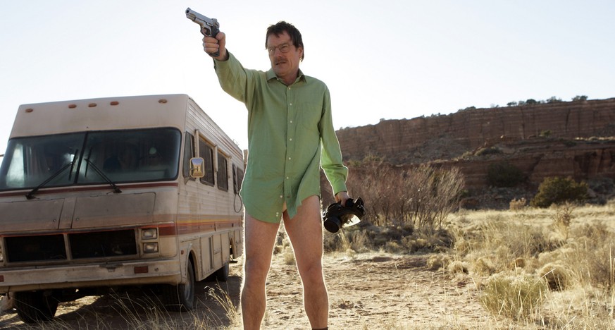 This image released by AMC shows Walter White, played by Bryan Cranston, next to the Winnebago he uses as a mobile meth lab in the pilot episode of &quot;Breaking Bad.&quot; The series finale of the p ...