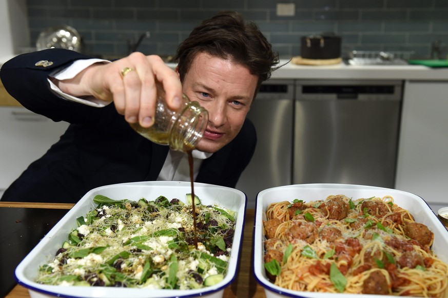 epa05615463 (FILE) A file photograph showing British Celebrity chef Jamie Oliver helping out at Jamie&#039;s Ministry of Food in Sydney Australia, 30 March 2015. Media reports on 03 November 2016 stat ...