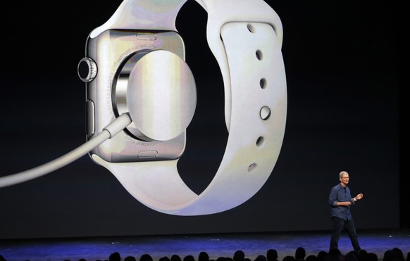 epa04392929 Apple CEO Tim Cook introduces the new Apple Watch during Apple&#039;s launch event at the Flint Center for the Performing Arts in Cupertino, California, USA, 09 September 2014. The Flint C ...