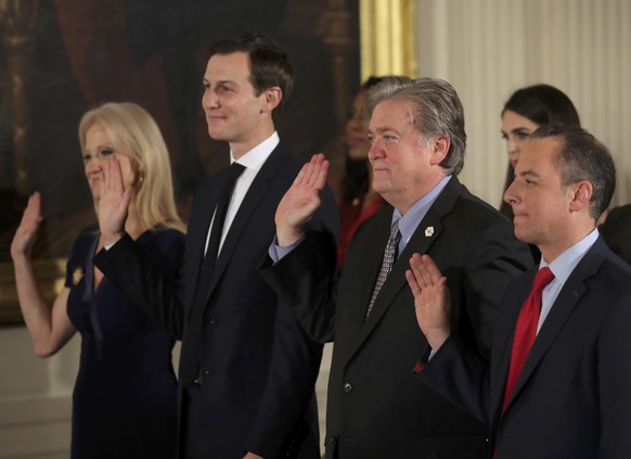 Senior staff at the White House Kellyanne Conway, Jared Kushner, Steve Bannon and Reince Priebus (L-R) are sworn in by Vice President Mike Pence in Washington, DC January 22, 2017. REUTERS/Carlos Barr ...
