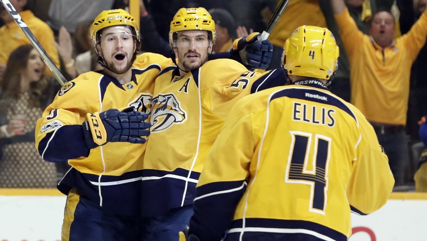 Nashville Predators defenseman Roman Josi (59), of Switzerland, celebrates with Filip Forsberg (9), of Sweden, and Ryan Ellis (4) after Josi scored against the Chicago Blackhawks during the second per ...