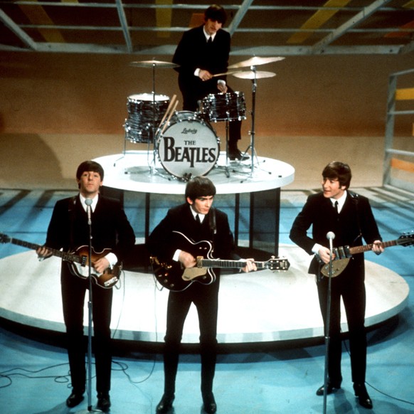 FILE - In this Feb. 9, 1964 file photo, The Beatles perform on the CBS &quot;Ed Sullivan Show&quot; in New York. They love us, yeah! yeah! yeah! At 12:01 a.m. local time on Dec. 24, 2015, around the w ...