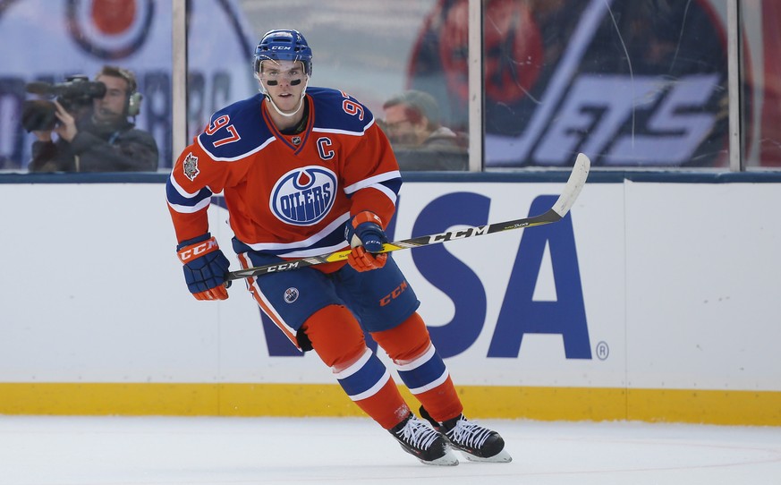 Oct 23, 2016; Winnipeg, Manitoba, CAN; Edmonton Oilers center Connor McDavid (97) during the first period against Winnipeg Jets at the 2016 Heritage Classic ice hockey game at Investors Group Field. M ...