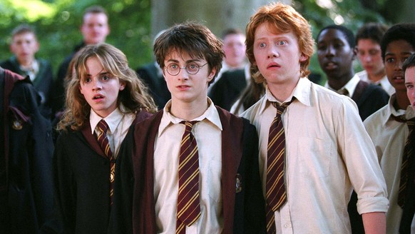 In this image released by Warner Bros., from left, Emma Watson as Hermione Granger, Daniel Radcliffe as Harry Potter and Rupert Grint as Ron Weasley are shown in a scene from &quot;Harry Potter and th ...