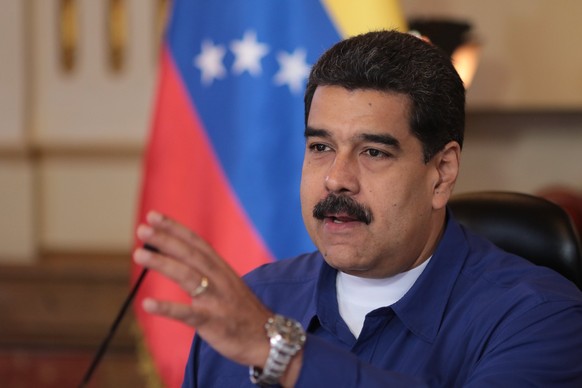 epa06093668 A handout photo made available by Miraflores Palace shows Venezuelan President Nicolas Maduro speaking during a Government meeting in Caracas, Venezuela, 17 July 2017. Maduro has said the  ...