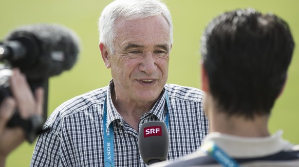 Hanspeter Latour, SRF co-moderator, speaks during an interview at a training session of the Swiss national soccer team in Porto Seguro, Brazil, Wednesday, June 18, 2014. (KEYSTONE/Peter Klaunzer)