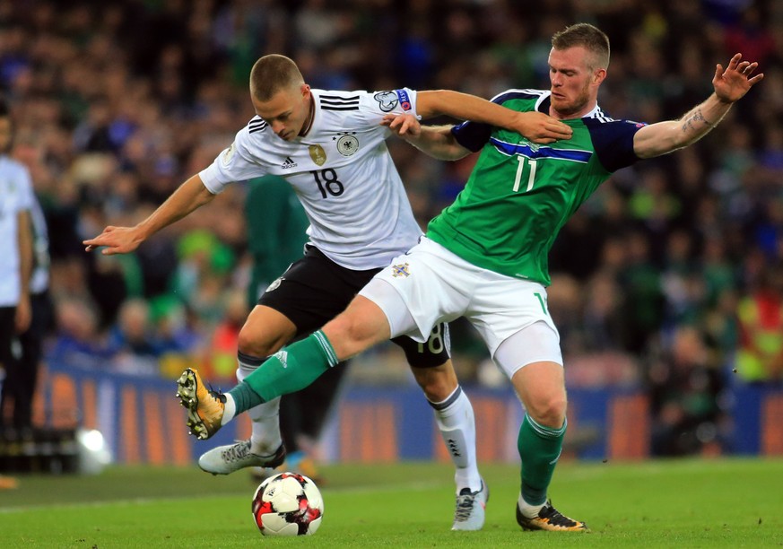 epa06246871 Northern Irelands Chris Brunt (R) clashes with Germany&#039;s Joshua Kimmich during the FIFA World Cup 2018 qualifying soccer match between Northern Ireland and Germany, in Belfast, North ...