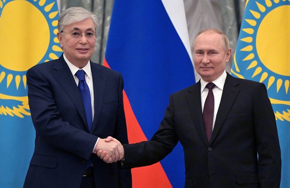 Russian President Vladimir Putin, right, and Kazakhstan&#039;s President Kassym-Jomart Tokayev shake hands after their joint news conference following the talks in the Kremlin in Moscow, Russia, Thurs ...