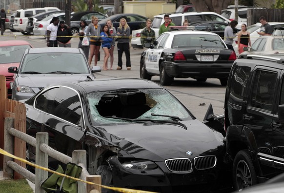 The vehicle of the alleged shooter is pictured at one of the crime scenes after a series of drive-by shootings in the Isla Vista section of Santa Barbara May 24, 2014. A lone gunman sprayed bullets fr ...