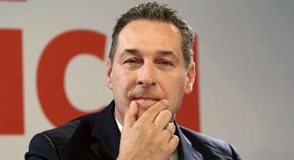 FILE - In this Dec. 6, 2016 file photo Heinz-Christian Strache, chairman of the anti-migrant and anti-EU Freedom Party FPOE, gestures during a news conference after the presidential election in Vienna ...