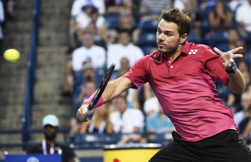 Stan Wawrinka, of Switzerland, returns the ball against Mikhail Youzhny, of Russia, at the Rogers Cup tennis tournament Tuesday, July 26, 2016, in Toronto. (Nathan Denette/The Canadian Press via AP)