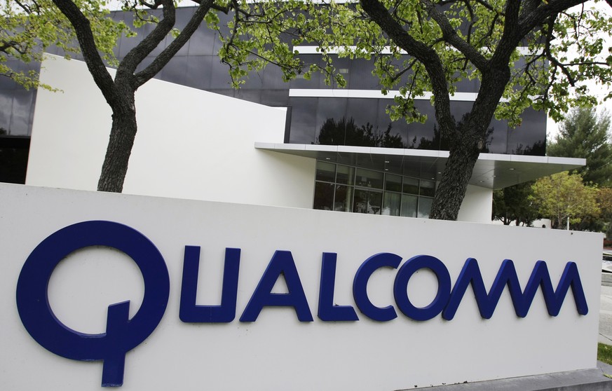 FILE - In this April 18, 2011 file photo, the corporate sign of Qualcomm Inc. is seen in front of its office in Santa Clara, Calif. China fined chipmaker Qualcomm 6 billion yuan ($975 million) in the  ...