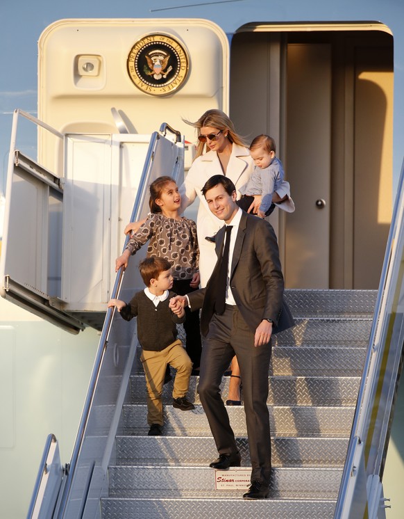 Ivanka Trump, rear, and her husband Jared Kushner step off of Air Force One with their children as they arrive in West Palm Beach, Fla., Friday, Feb. 10, 2017. President Donald Trump is hosting Japane ...