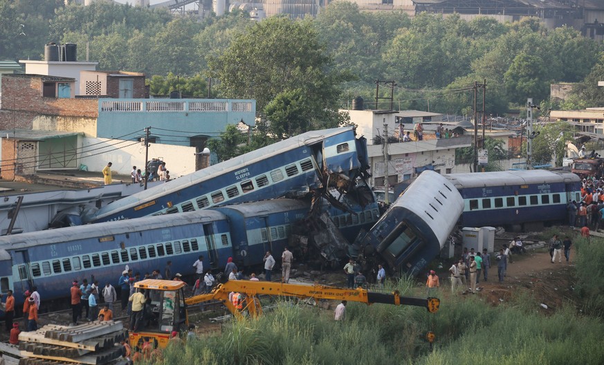 epa06152658 Rescue work continues at the site of a train accident where coaches of Puri-Haridwar Kalinga Utkal Expresss train derailed in Khatauli near Muzaffarnagar, India, 20 August 2017. According  ...