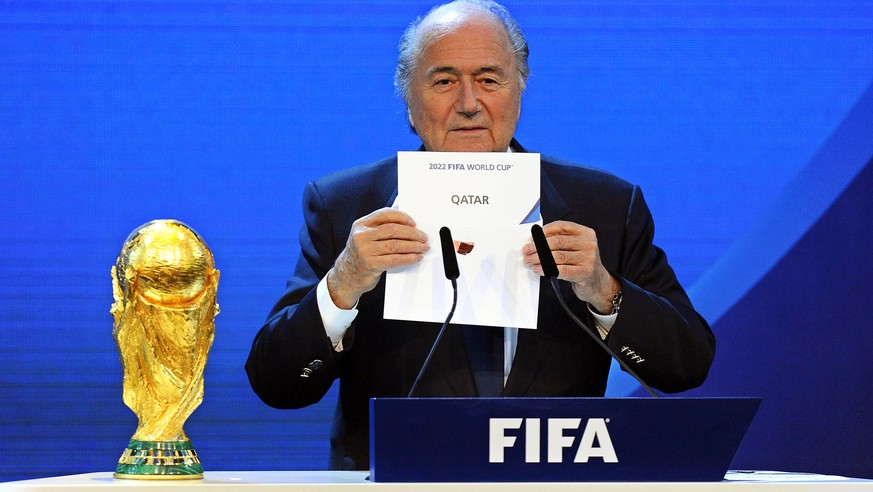 epa06052570 (FILE) - FIFA President Joseph Blatter announces that Qatar would be hosting the 2022 Soccer World Cup during the FIFA 2018 and 2022 World Cup Bid announcement in Zurich, Switzerland, 02 D ...