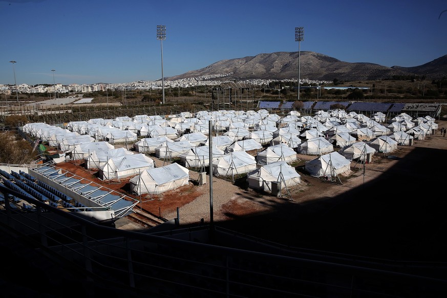 epa05713391 General view of a temporary refugee camp settled inside the playfield of the Olympic Baseball Stadium in Hellinikon complex, opposite the old Athens Airport, Greece, 12 January 2017. More  ...