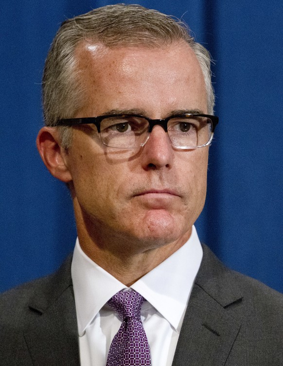 FILE - In this July 20, 2016, file photo, FBI Deputy Director Andrew McCabe listens during a news conference at the Justice Department in Washington. McCabe was elevated to acting FBI director after F ...