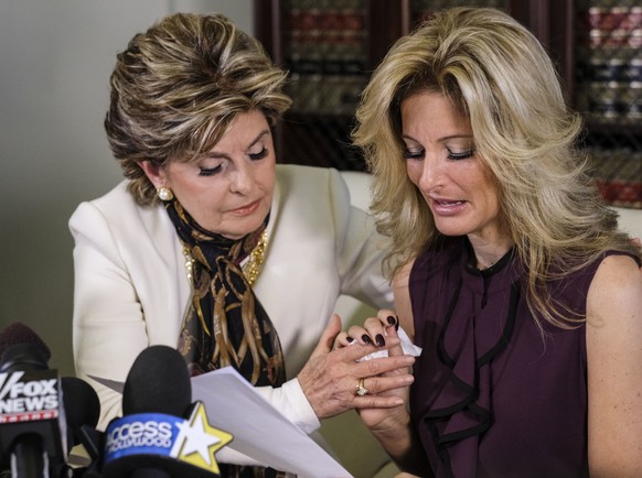 Attorney Gloria Allred, left, comforts Summer Zervos as Zervos reads a statement during a news conference in Los Angeles, Friday Oct. 14, 2016. Zervos, a former contestant on &quot;The Apprentice&quot ...