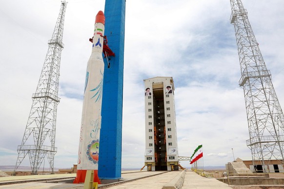 epa06113101 A handout photo made available by the Iranian Defence ministry official website shows Simorgh satellite rocket before lunching at the Imam Khomeini National space Centre in an undisclosed  ...