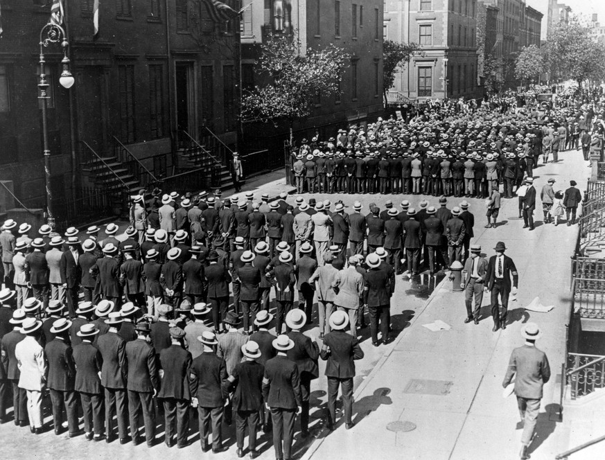 In this April 1917 file photo, World War I Army recruits who answered the call to enlist fill a street in New York City shortly after President Woodrow Wilson declared war on Germany. Thursday, April  ...