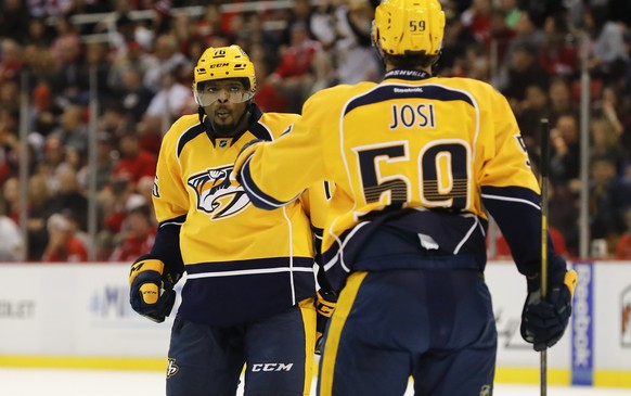 Oct 21, 2016; Detroit, MI, USA; Nashville Predators defenseman P.K. Subban (76) receives congratulations from defenseman Roman Josi (59) after scoring in the second period against Detroit Red Wings at ...