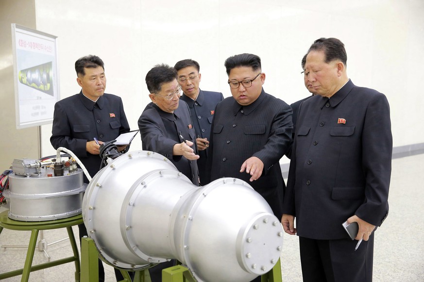 FILE - This undated file photo distributed on Sept. 3, 2017, by the North Korean government, shows North Korean leader Kim Jong Un, second from right, at an undisclosed location in North Korea. Five m ...