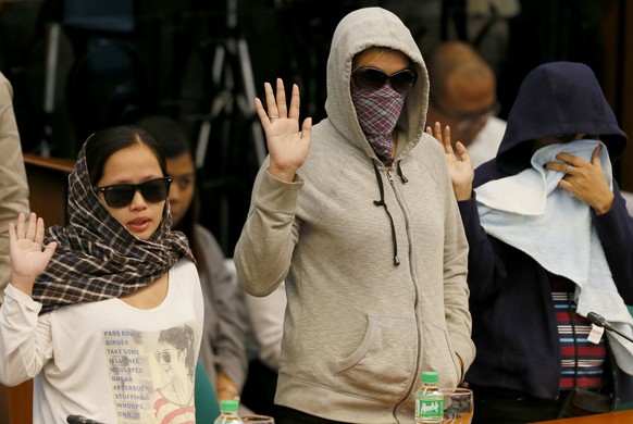 Relatives of victims of alleged extra judicial killings take their oaths at the start of the Senate probe on the rising number of deaths related to President Rodrigo Duterte&#039;s &quot;War on Drugs& ...