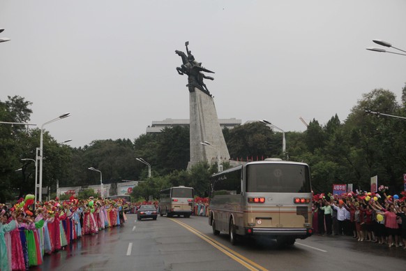 In this Wednesday, Sept. 6, 2017 photo, Pyongyang residents welcome contributors to their country’s sixth underground nuclear test, in Pyongyang, North Korea. The test of what Pyongyang claims was an  ...