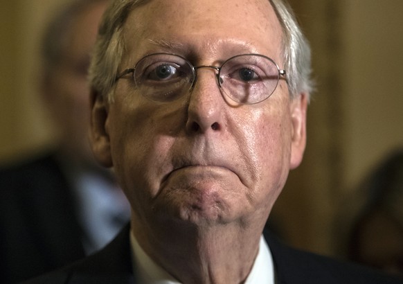 In this June 27, 2017, photo, Senate Majority Leader Mitch McConnell, R-Ky., tells reporters he is delaying a vote on the Republican health care bill at the Capitol in Washington. Congressional Republ ...
