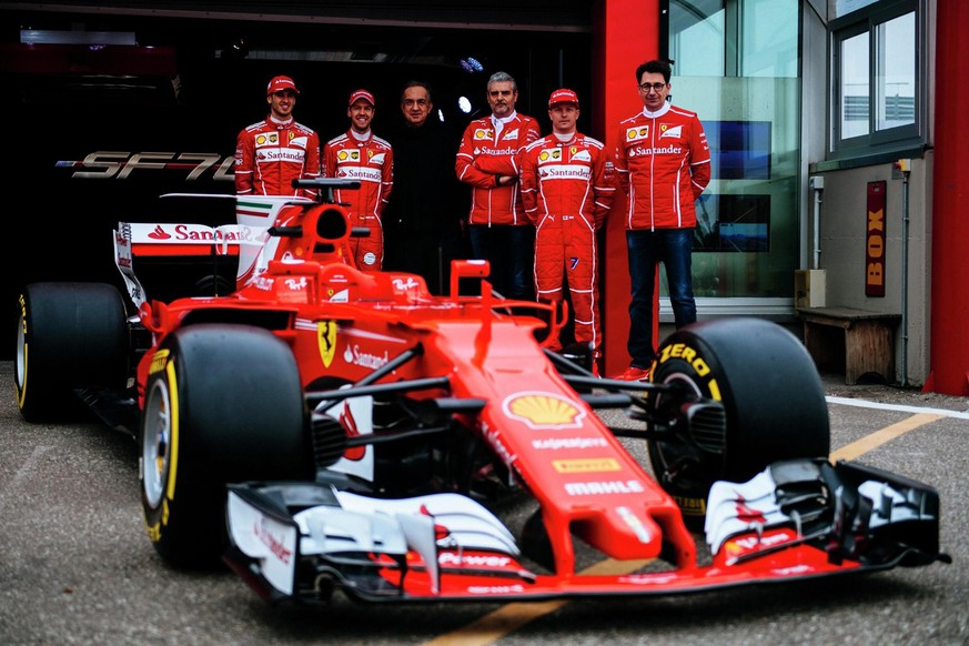 epa05813127 A handout picture made available by Ferrari press office shows a moment of official presentation of the new Ferrari Formula One SF70H. Standing rear from left side the drivers Antonio Giov ...