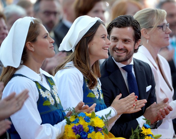 Swedish Princess Madeleine, Princess Sofia and Prince Carl Philip (L-R) are seen during the official National Day of Sweden celebrations at the Skansen open-air museum in Stockholm, Sweden June 6, 201 ...